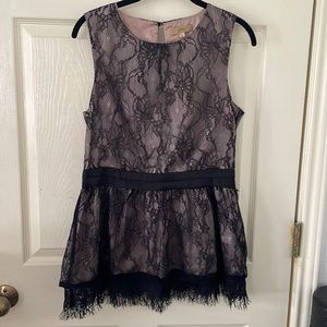 Beautiful lace detailed sleeveless top with cut out in the back